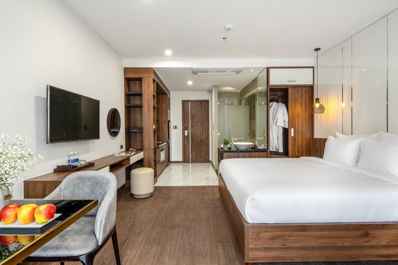 Sharon Deluxe Studio bedroom with king bed and kitchenette
